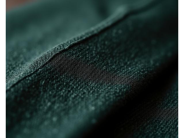 Close-up of a business suit's fabric texture and precise stitching, emphasizing quality and detail.